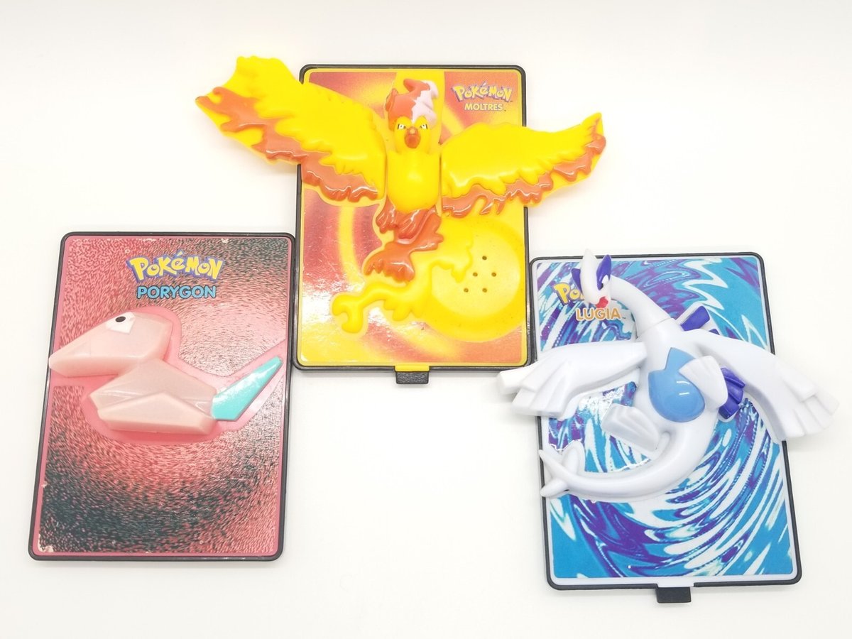 Burger King made a card that pops up into a little moving Pokémon toy. The 2000 Kids Meal Power Cards had 24 plastic designs tied to Pokémon 2000. It's a card, a stand, and a desk toy all fighting for control of the same object. I would've needed every single one, obviously.