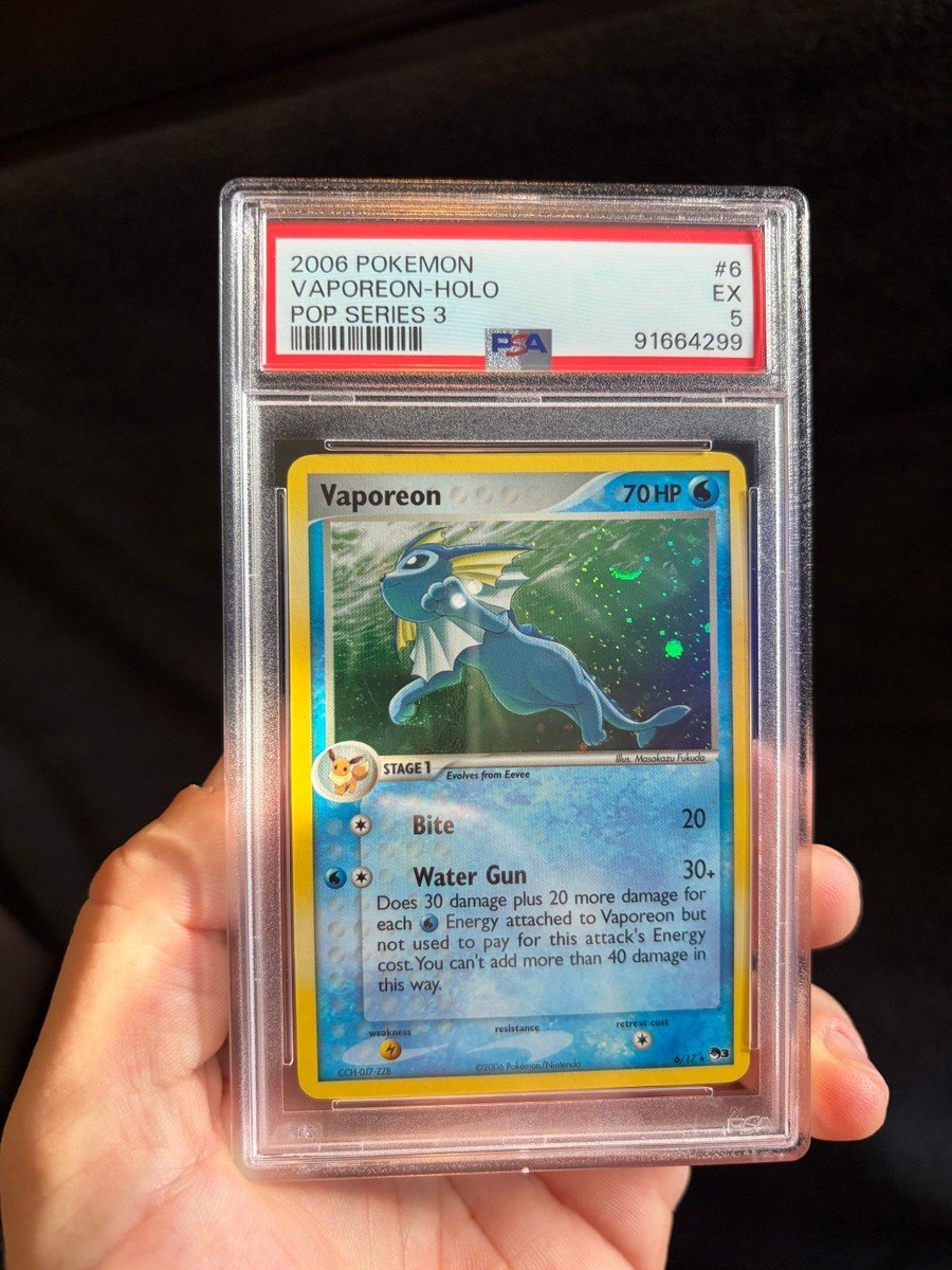 Vaporeon ex — Japanese 2006
PSA 9 / Mint

Vaporeon ex looks like it reserved the entire pool for a private appointment. A vintage Japanese ex card makes me speak more formally than my coworkers prefer. The water bill for this inspection will be forwarded to the collector.